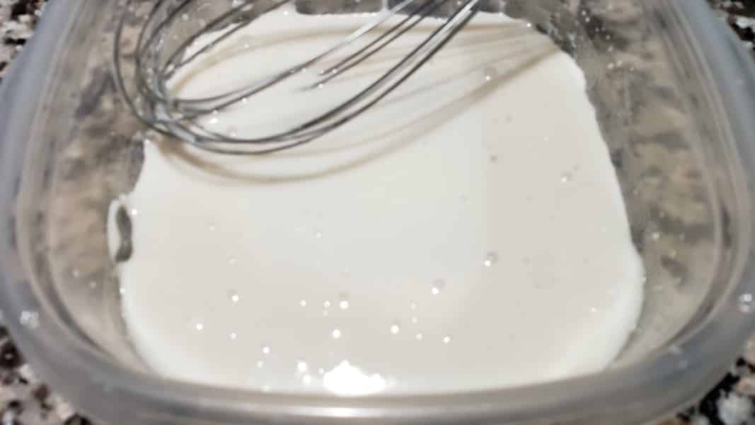 powdered sugar glaze mixed in a bowl.
