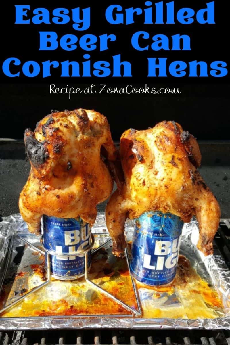 two Grilled Beer Can Cornish Hens cooking on a grill.