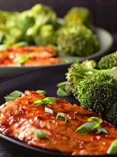 Grilled Salmon with Thai Sweet Chili Glaze on two plates.