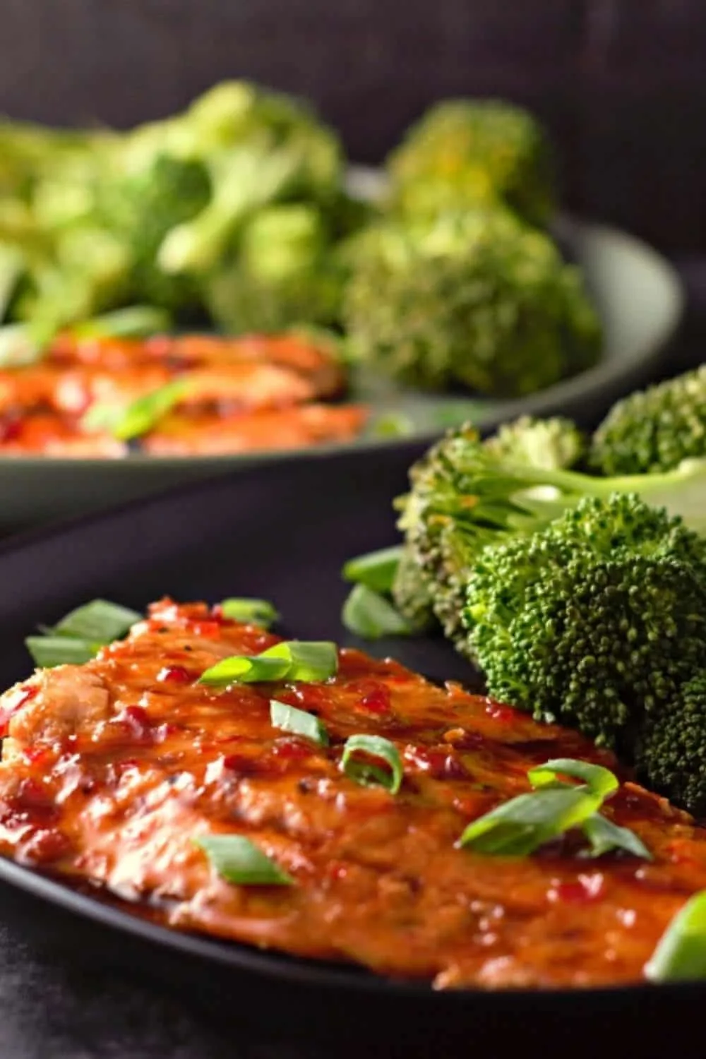 Grilled Salmon with Thai Sweet Chili Glaze on two plates.