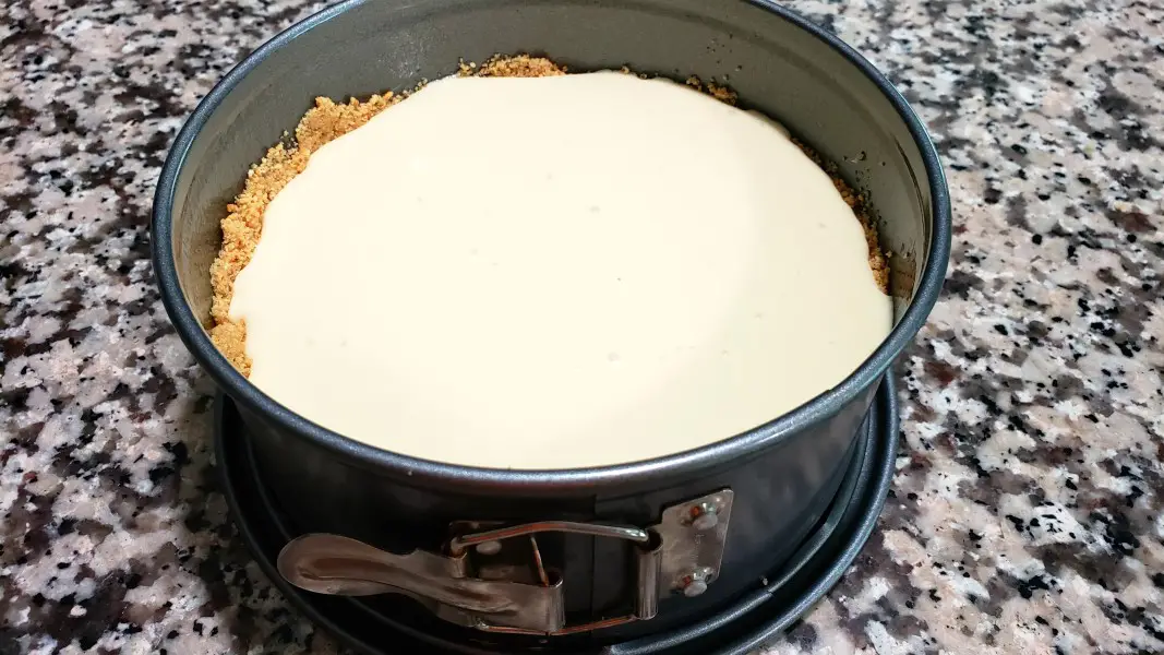 lemon cheesecake filling poured into 7 inch springform pan.