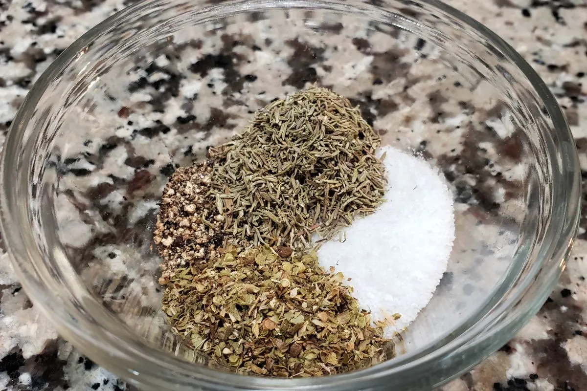 oregano, pepper, thyme and salt in a bowl.