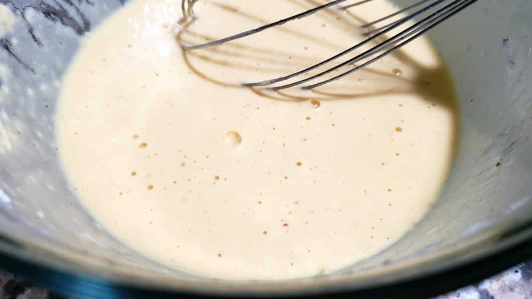beer batter whisked in a bowl.