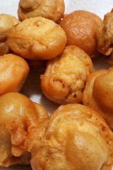 Beer Battered Deep Fried Mushrooms on paper towel.