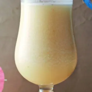 a Banana Daiquiri drink in a tall glass.