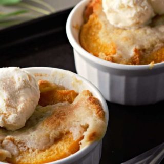 two Peach Cobblers in ramekins.