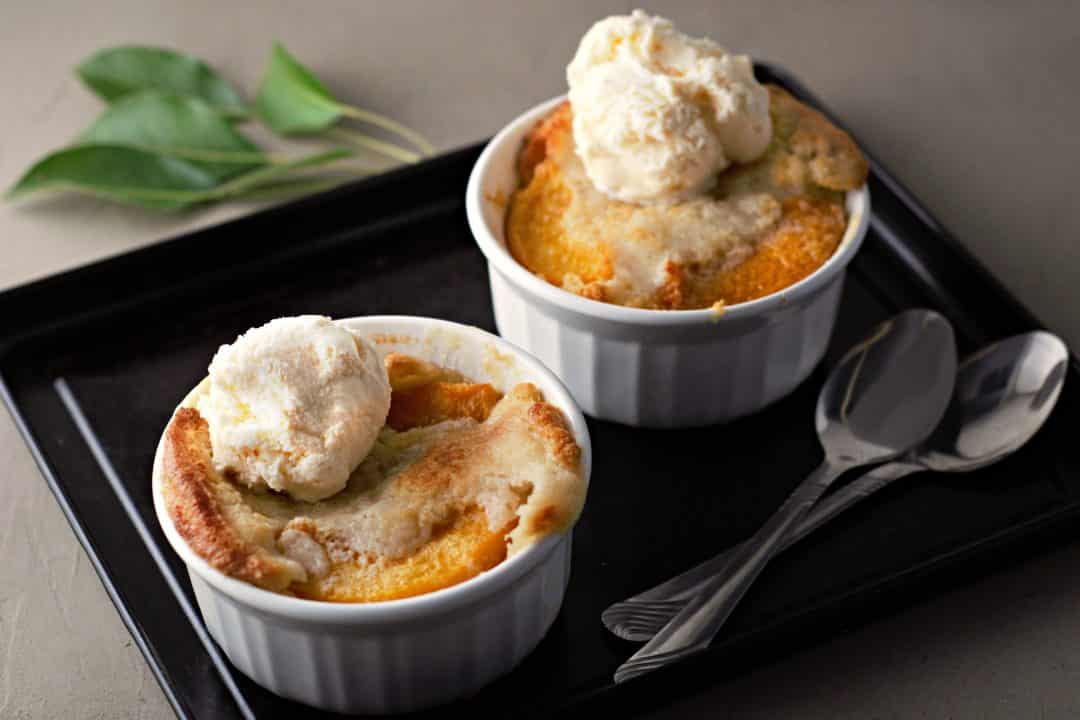 Two Easy Individual Peach Cobblers for two on a tray.