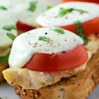 two Open Face Chicken Caprese Sandwiches on a plate.