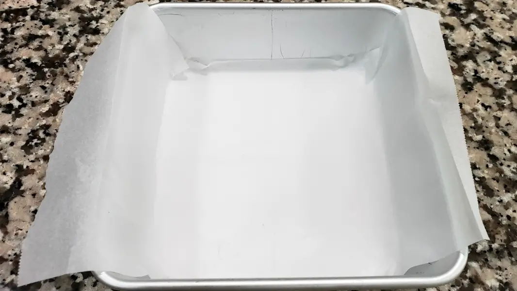 a small cake pan lined with parchment paper.