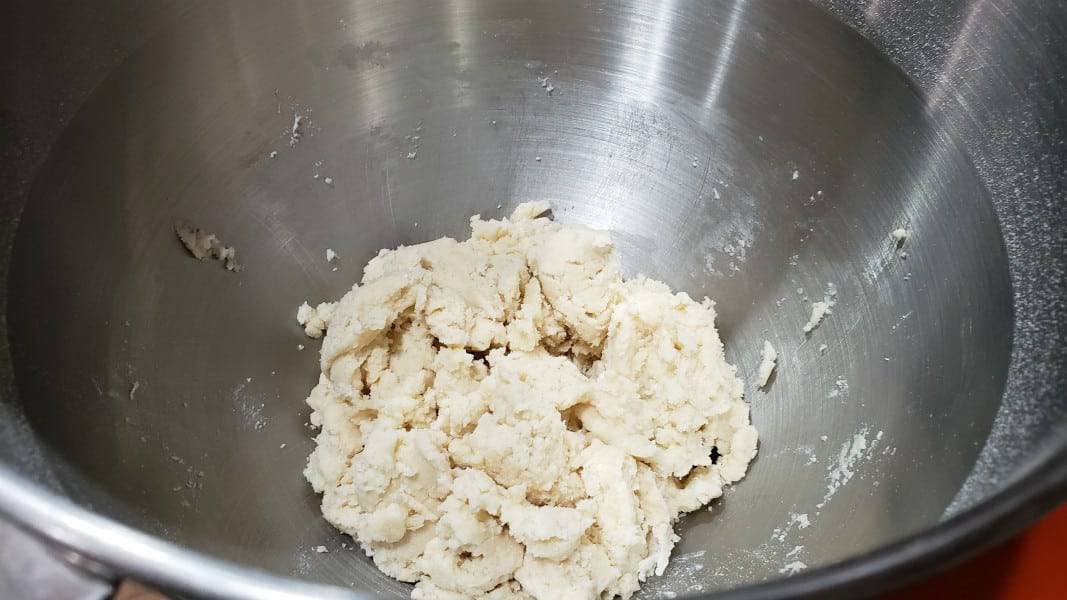 shortbread crust dough in a stand mixer bowl