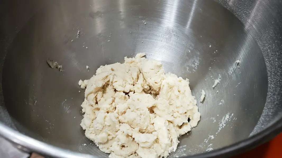 shortbread crust dough in a stand mixer bowl.