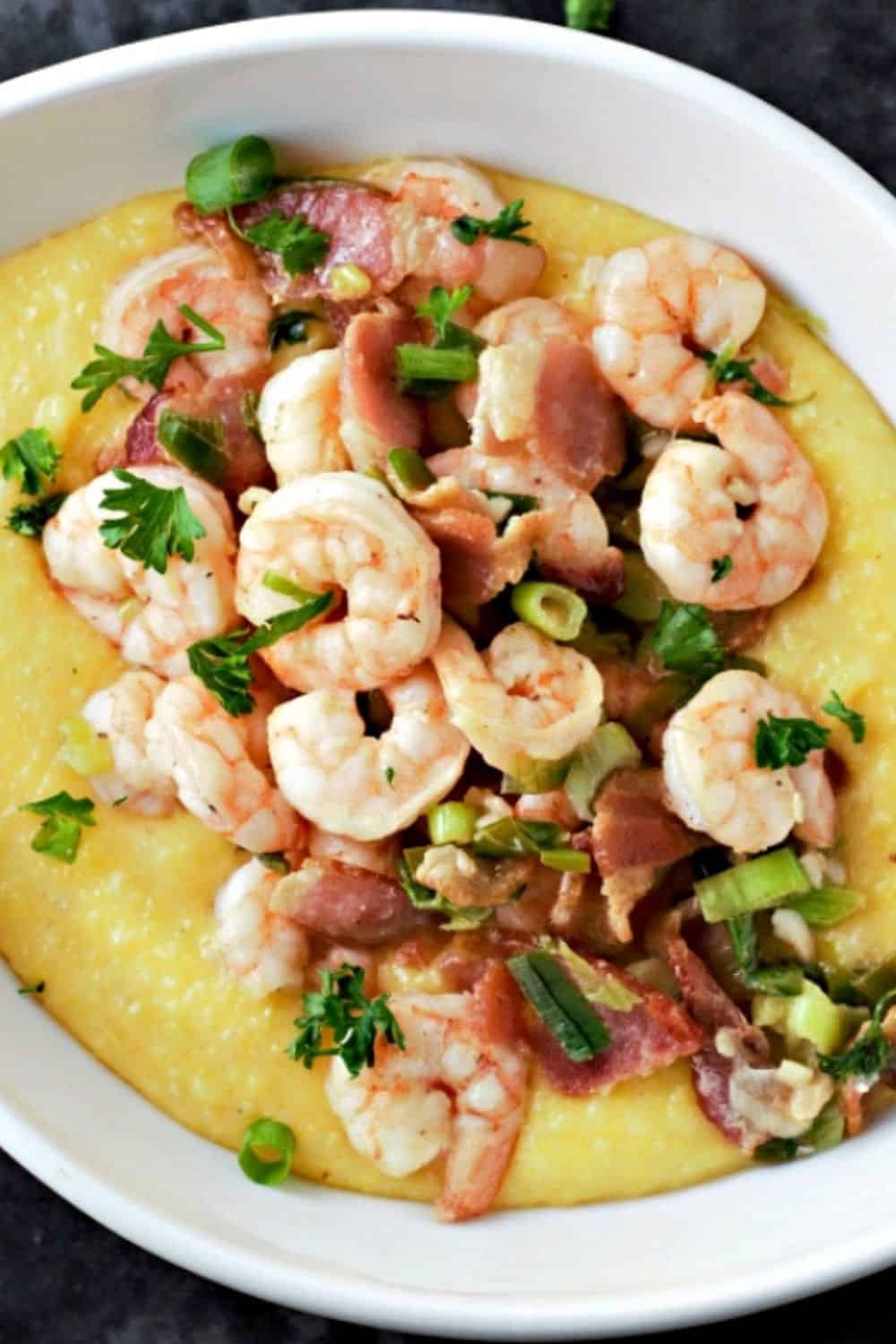 Shrimp and Polenta with Bacon in a oval bowl.