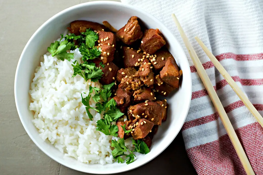 Slow Cooker Teriyaki Chicken in a bowl with rice.