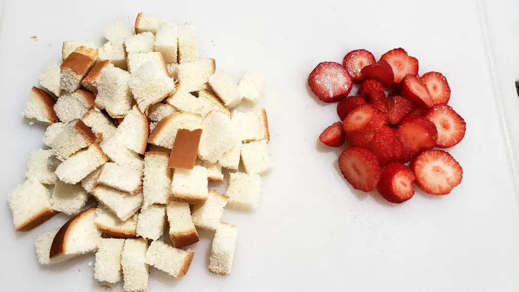 sliced strawberries and cubed bread.