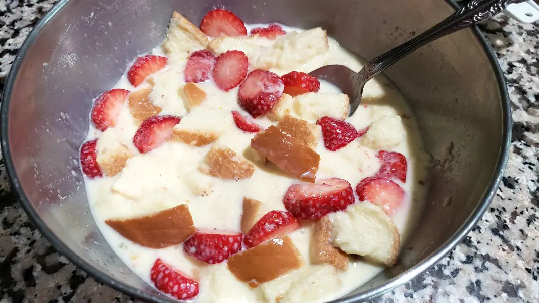 bread and strawberries in custard mixture.