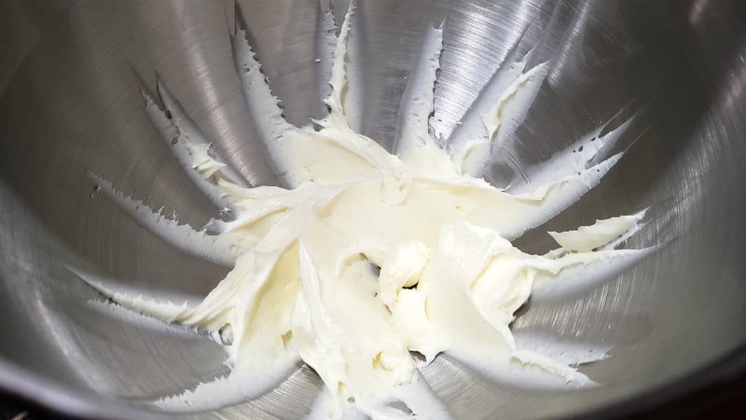 cream cheese and sugar creamed in a mixer bowl.