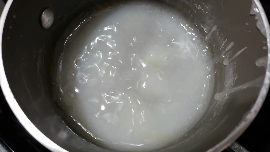 cornstarch, sugar, salt, and water cooking in a pan.