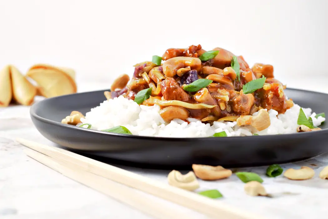 a plate filled with Easy Crock pot Cashew Chicken.