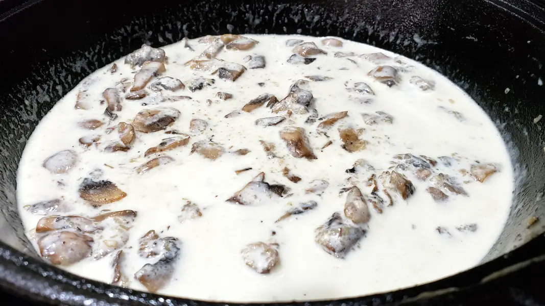 mushrooms cooking in heavy cream.