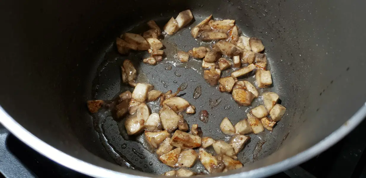 mushrooms cooking in a pan