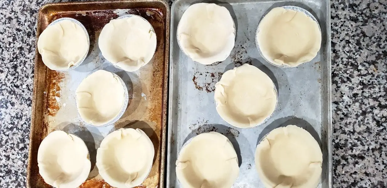 10 mini pie tins filled with crusts