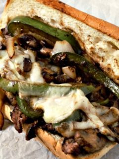 Ribeye Philly Cheesesteak Sandwich on parchment paper.