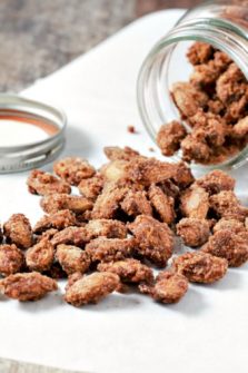 Candied Cinnamon Almonds pouring out of a jar.