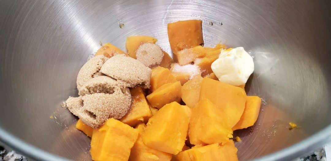 cubed sweet potatoes, brown sugar, butter, salt, and vanilla in a bowl