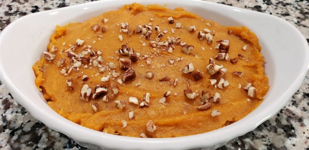 pecans sprinkled on top of sweet potato casserole