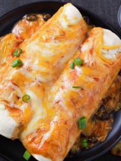 Chicken and Black Bean Enchiladas on a plate.