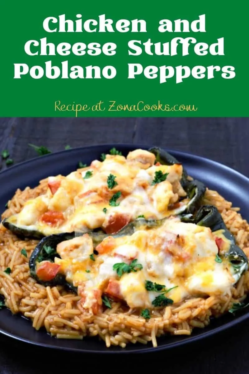 Chicken Stuffed Poblano Peppers over rice on a plate.