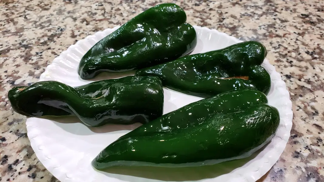 4 poblano pepper halves with skin side oiled