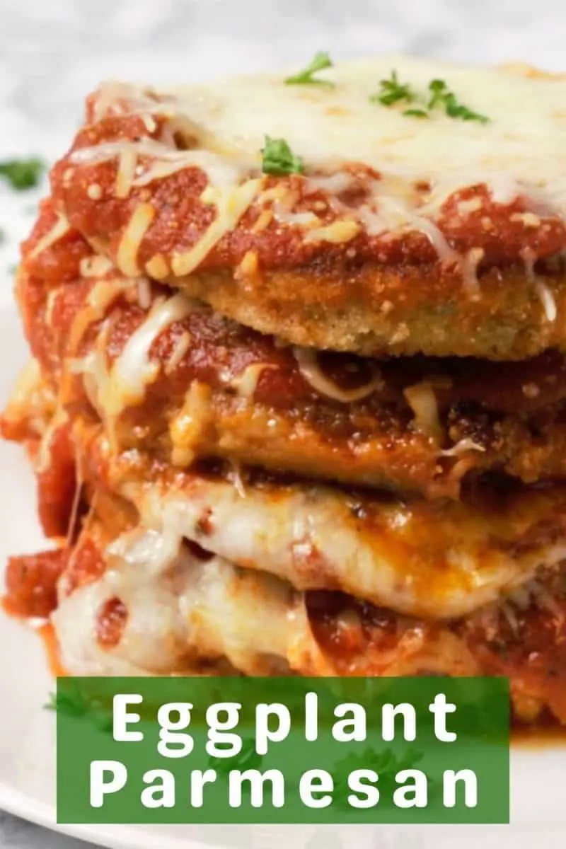 a stack of 4 Breaded Baked Eggplant Parmesan on a plate.