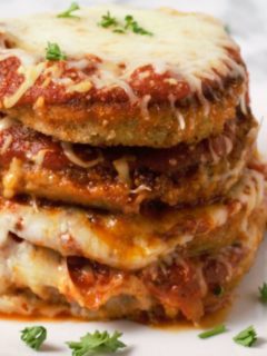 a stack of Eggplant Parmesan on a plate.