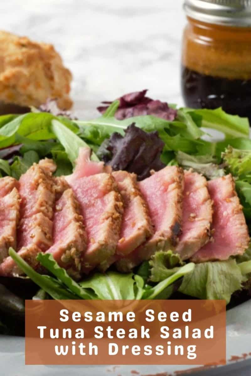 a plate filled with Seared Tuna Salad with Asian Ginger Dressing  on the side.