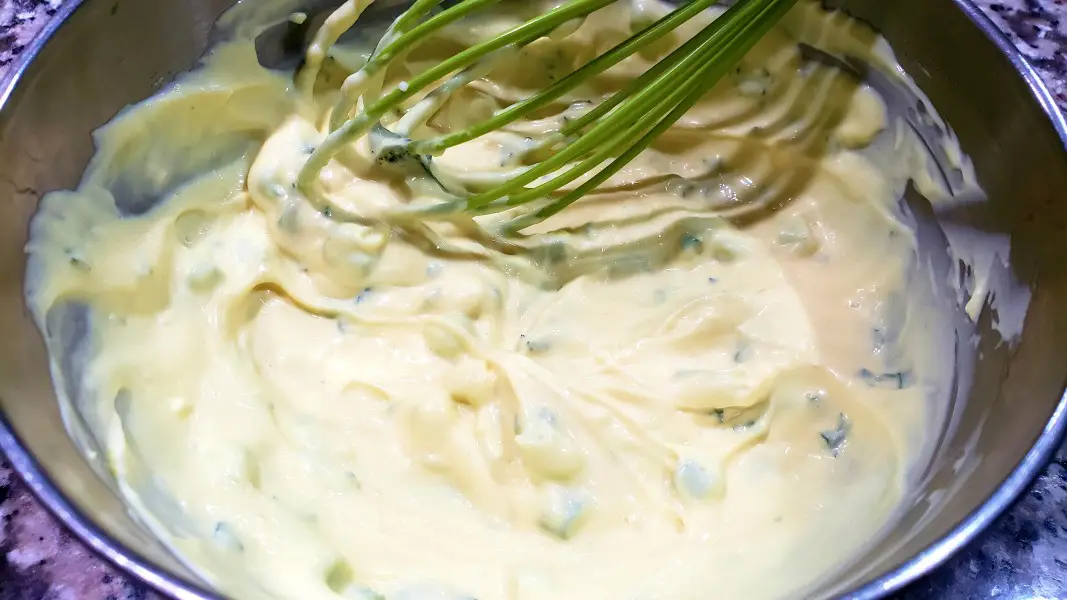 mayo sauce mixed in a bowl with a whisk