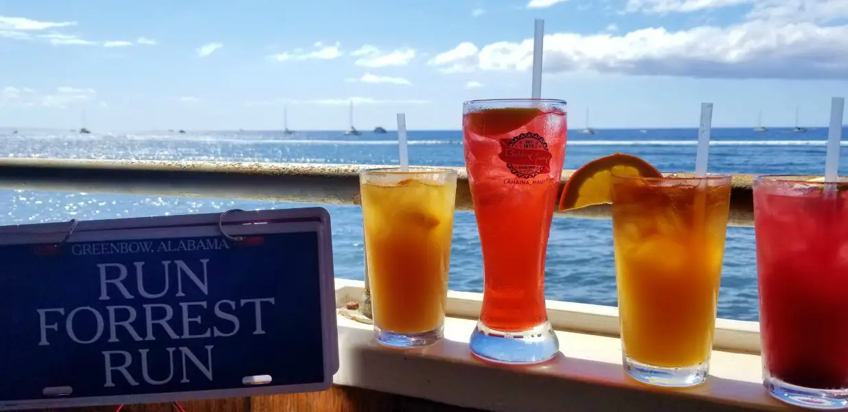 4 tropical drinks with an ocean back drop at Bubba Gump Shrimp Co.