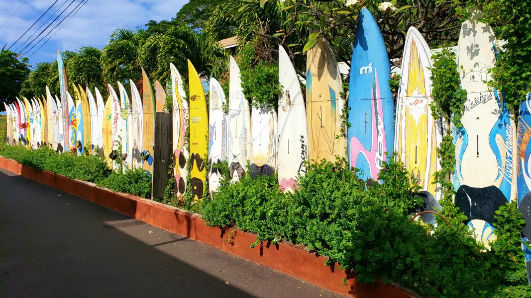 a surf board fence in the town of Paia