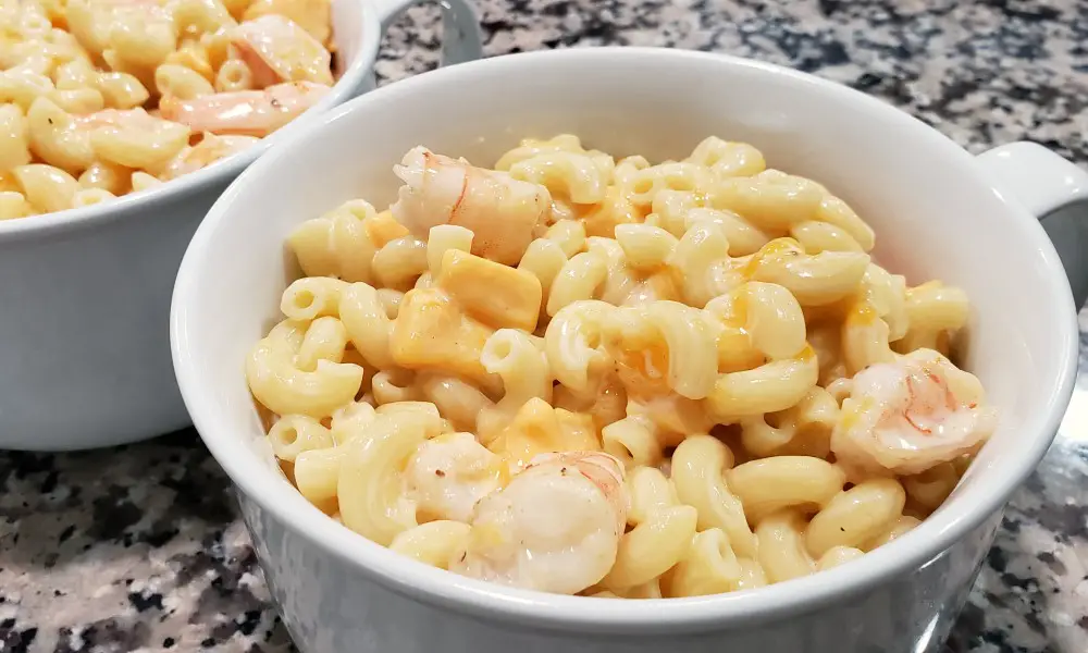 mac and cheese and shrimp in two casserole baking dishes