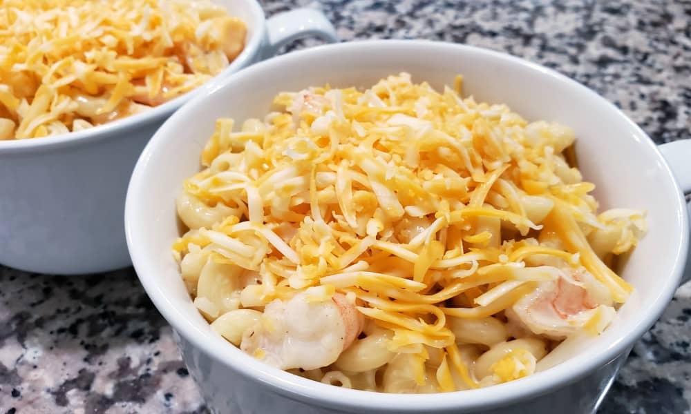 mac and cheese and shrimp in two casserole dishes.