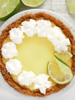 a small Key Lime Pie topped with whipped cream.