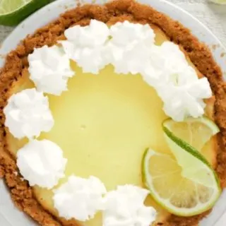 a small Key Lime Pie topped with whipped cream.