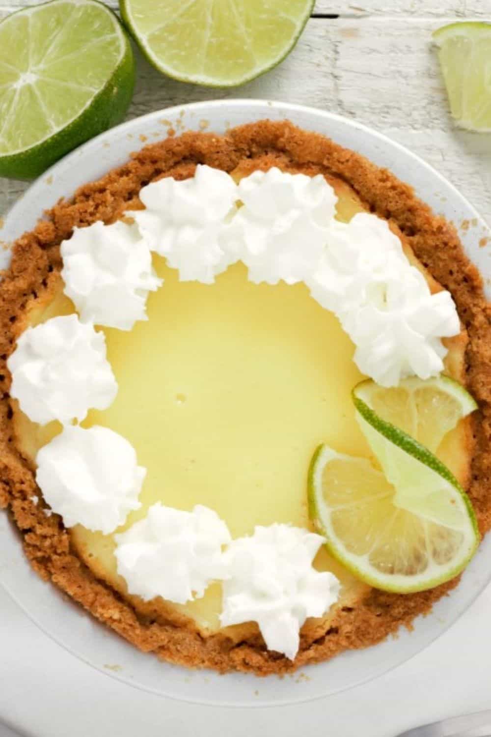 a small Key Lime Pie topped with whipped cream.