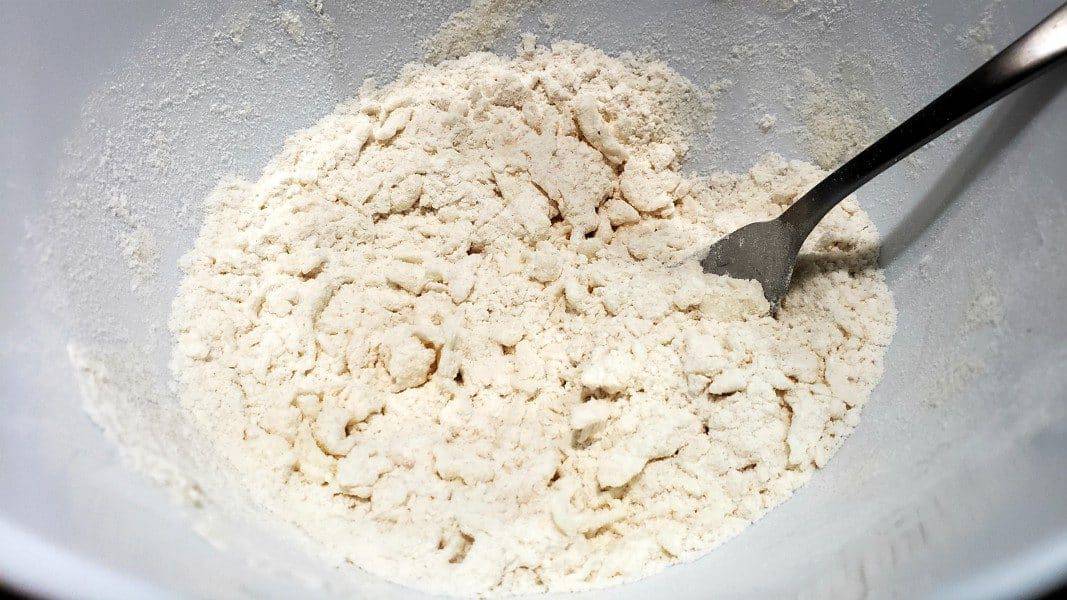 flour, sugar, salt, and shortening mixed in a bowl