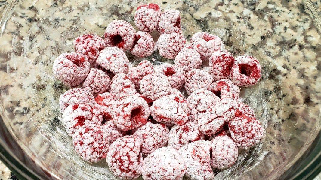 raspberries, cornstarch, and sugar mixed in a bowl