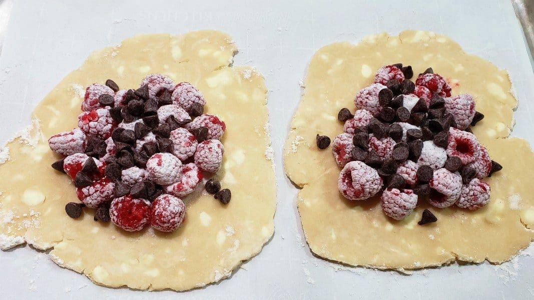 chocolate chips added on top of raspberry mixture
