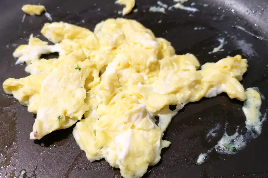 scrambled egg cooking in a pan