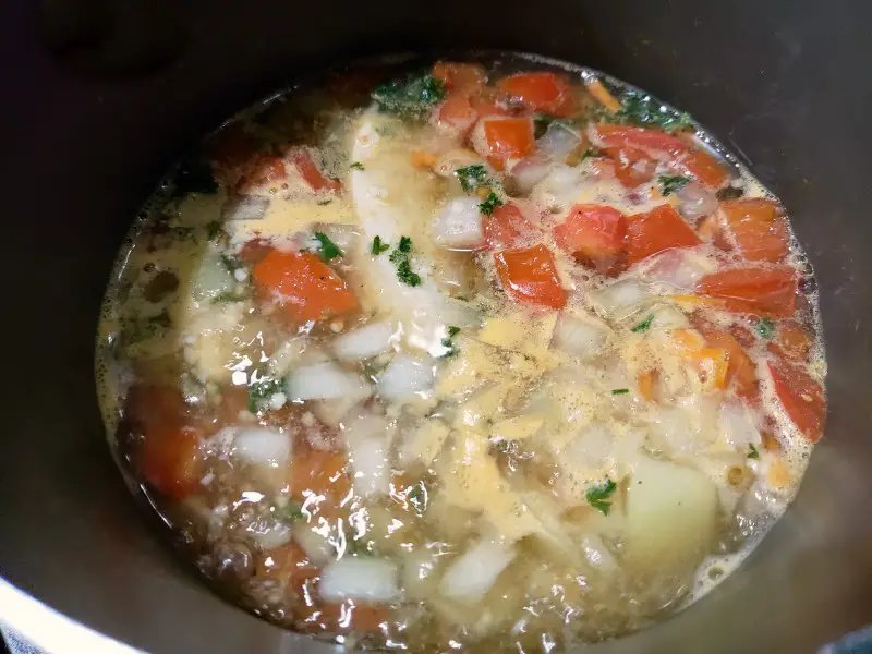 Tuscan soup simmering in a sauce pan