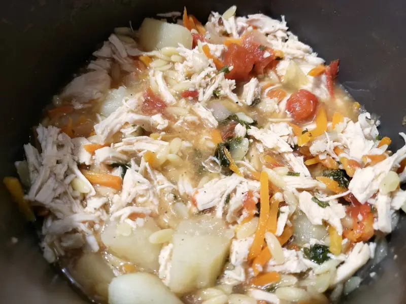 Tuscan Chicken Orzo Soup cooking in a pan