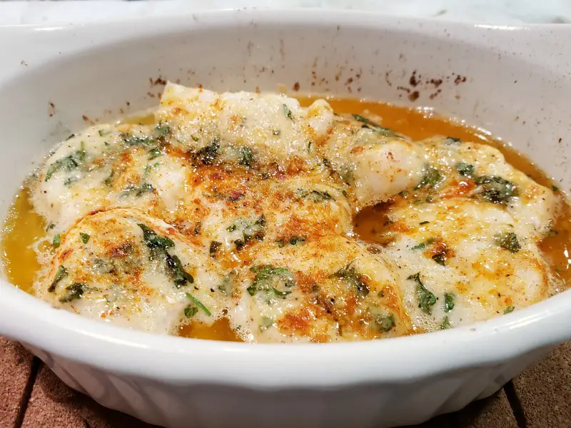 Baked Buttery Parmesan Scallops in a casserole dish